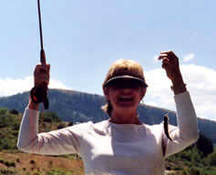 Lady holding up a small fish